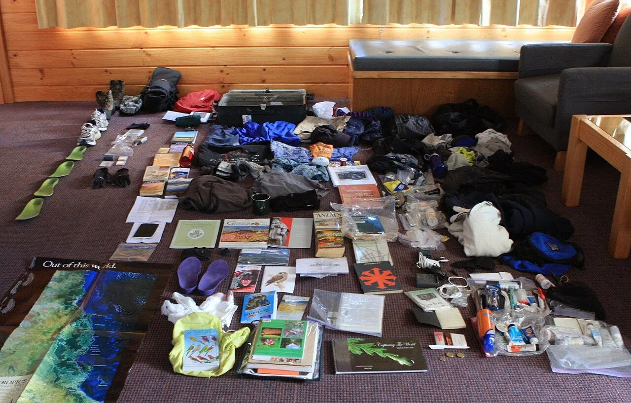 Here is the unpacked photo - this is what I brought (and acquired) on a 32 day trip to Australia. One challenge is that I had to pack for weather ranging form tropical (Daintree Rain forest and Great 
